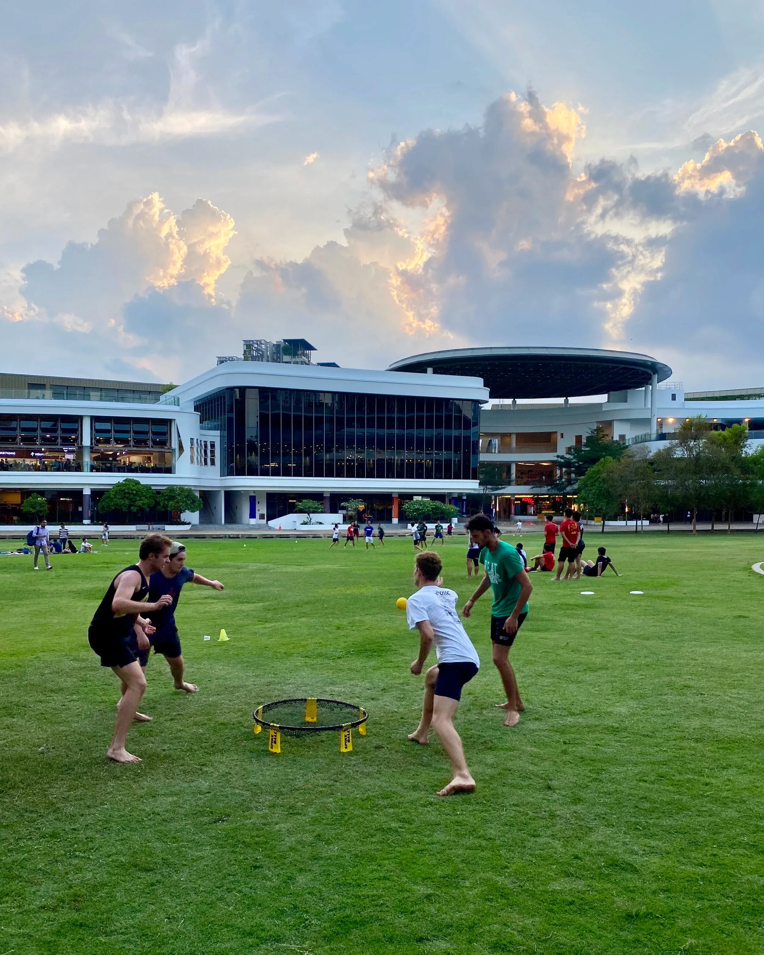Playing spike ball on the UTown green. I don’t thing any Singaporeans had seen it before.