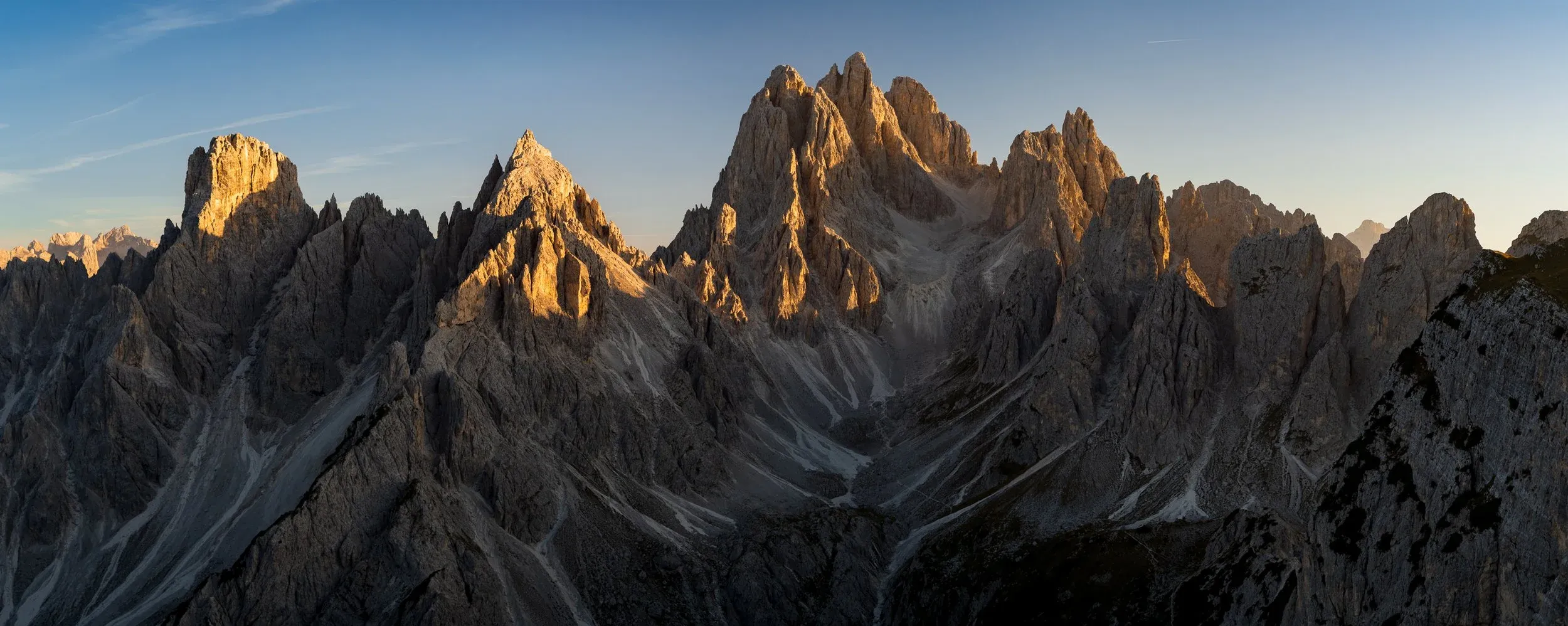 Jagged mountain ridge under late afternoon cloud cover.