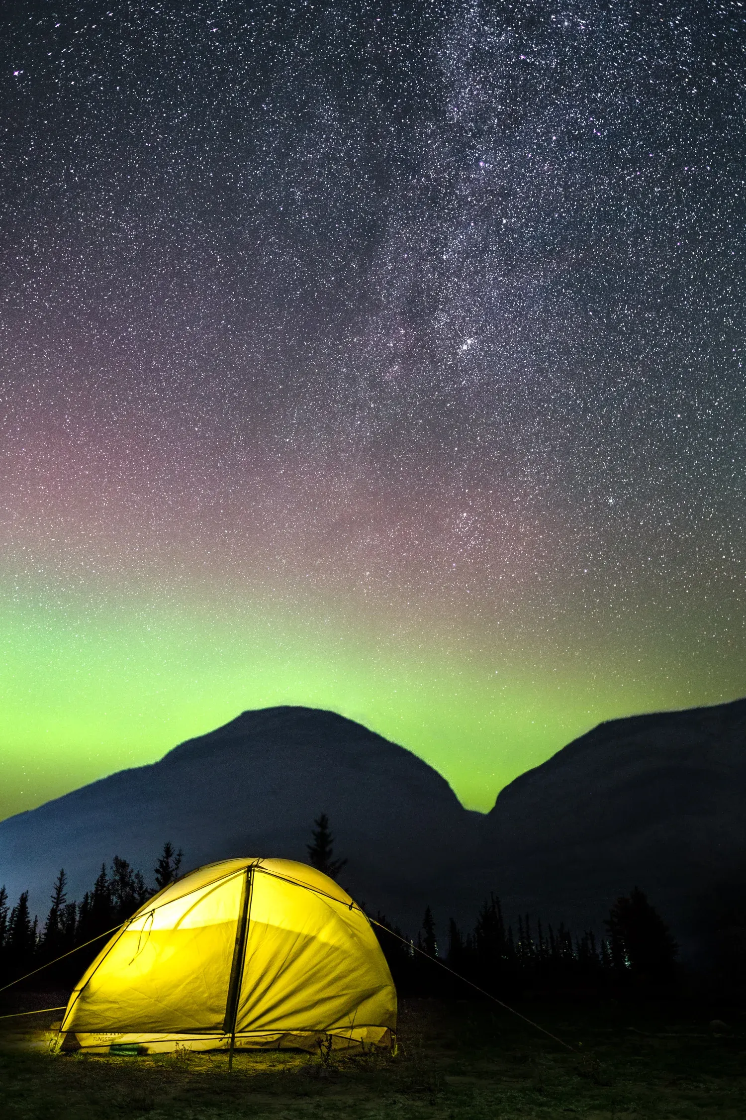 Morning light hitting a tent at the edge of camp.